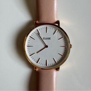 Pink leather strap watch with circular gold face